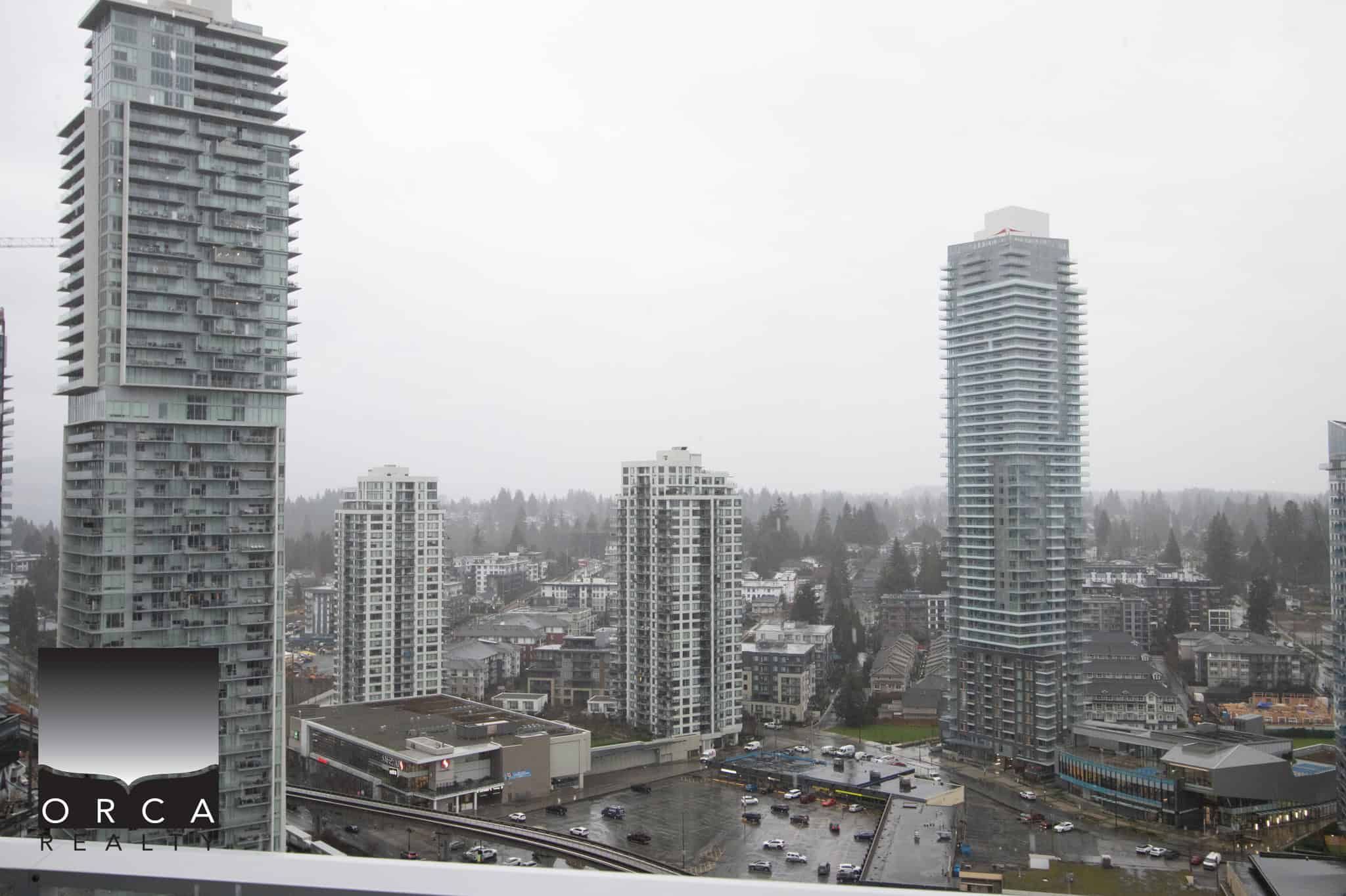 Panoramic view of Coquitlam cityscape featuring tall residential and commercial towers near 720 Farrow Street.