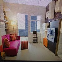 Apartment living room with pink sofa and large window, modern interior design, bright natural light, featuring entertainment centre and minimalist decor, ideal for Vancouver condo buyers.