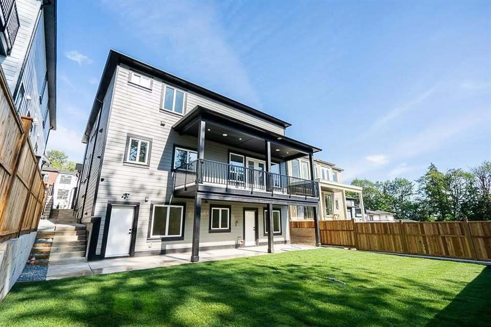 Spacious modern multi-family home with a backyard, ideal for real estate investment or family living, showcasing quality construction and great curb appeal in a desirable neighborhood.