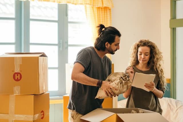 two tenants moving boxes