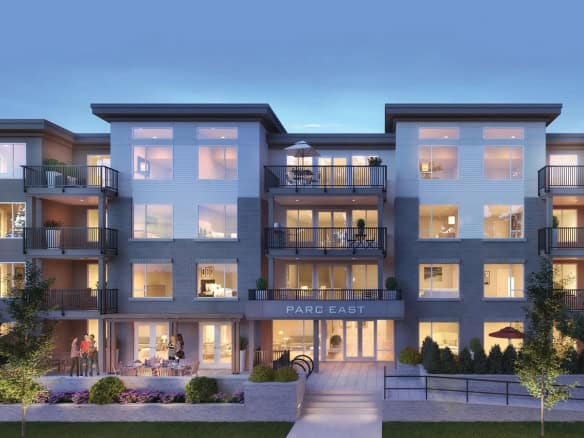 Luxury modern apartment building in Parc East with balconies, large windows, and landscaped outdoor space, offering prime real estate options in Vancouver, BC.