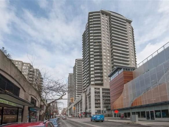 Modern high-rise residential buildings in downtown Vancouver, BC, showcasing luxury condos and urban living in a vibrant cityscape.