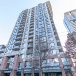 Modern high-rise apartment building in Vancouver with large glass windows and balcony amenities, part of Orca Realty Inc. property listings in downtown Vancouver.