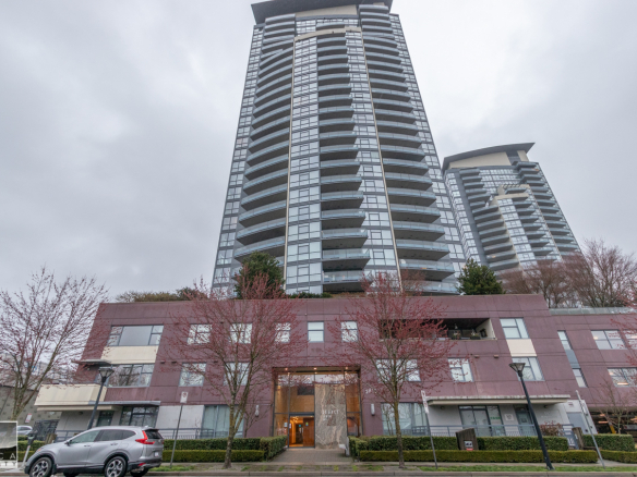 Modern high-rise condominium building in Vancouver, BC, showcasing luxury residential apartments and urban living by Orca Realty Inc.