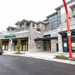 Modern mixed-use commercial and residential building in Vancouver with retail storefronts and upper-level condos by Orca Realty Inc.