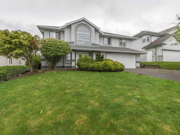 Spacious family home in a desirable neighbourhood with lush front yard, well-maintained landscaping, and a two-car garage. Perfect for buy or sell with Orca Realty Inc.