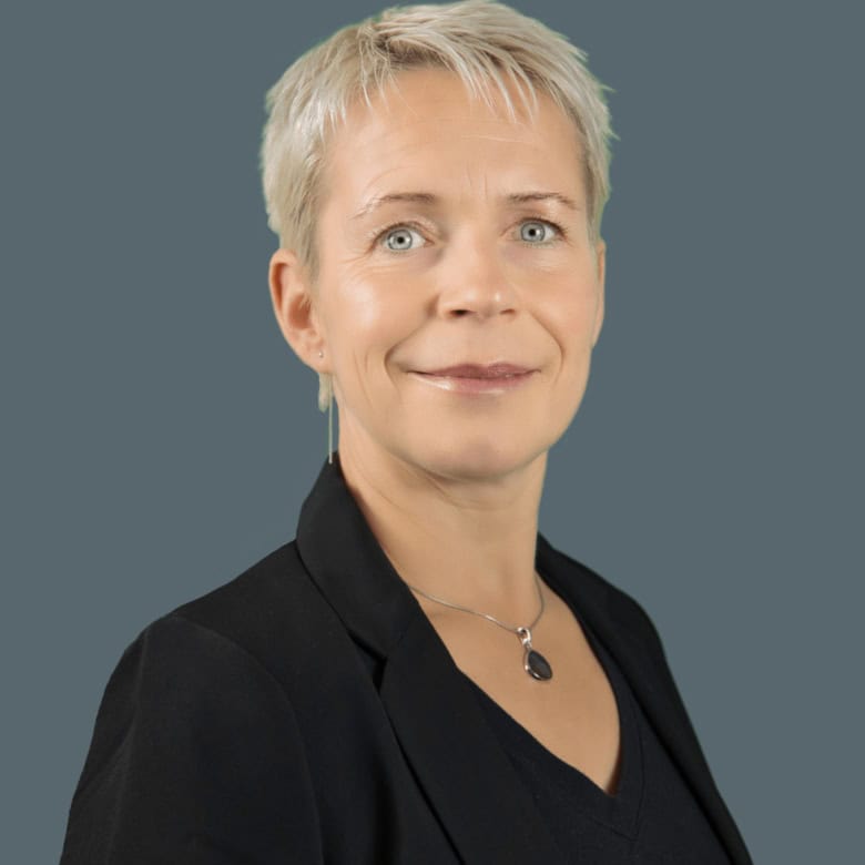 Professional woman real estate agent portrait at Orca Realty Inc. in Vancouver, showcasing expertise in residential and commercial property sales in BC.