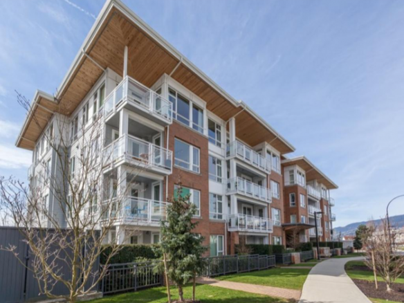 Orca Realty Inc. modern multi-storey apartment building with spacious balconies, located in a scenic urban area in en_CA.