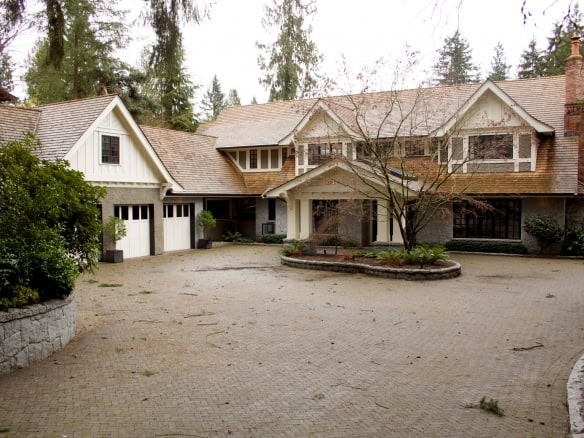 Luxurious Vancouver estate featuring elegant architecture, landscaped gardens, and a grand driveway, offered by Orca Realty Inc., your trusted real estate partner in British Columbia.