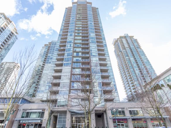 Luxurious high-rise condominium buildings in downtown Vancouver, featuring modern architecture and expansive balconies. Perfect for urban living and real estate investment in British Columbia.