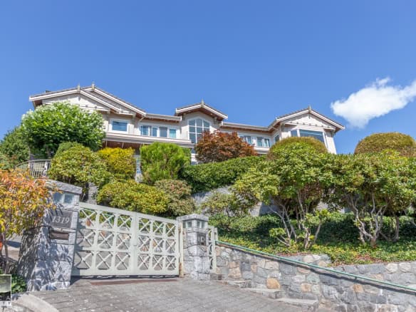 Luxurious waterfront home with stunning ocean views and landscaped gardens, available through Orca Realty Inc., your trusted Vancouver Island real estate expert.