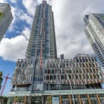 Modern high-rise condominiums in downtown Vancouver showcasing contemporary glass architecture and urban living. Prime real estate for buyers seeking luxury Vancouver condos.