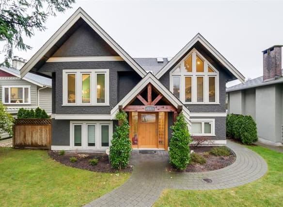 Bright and modern Vancouver-style home with striking architectural design and lush front yard landscaping. Perfect for families seeking luxury real estate in the Vancouver area.