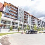 Contemporary multi-story apartment building with modern design, large balconies, and landscaped surroundings, ideal for Vancouver real estate investments and rental opportunities.