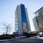 Contemporary high-rise condo building in Vancouver, BC, showcasing modern architecture and city living. Perfect for real estate investment or luxury residential living in a vibrant urban setting.