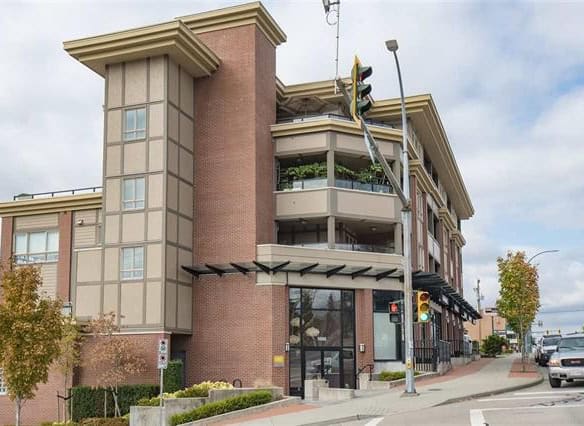 Modern mixed-use building with retail shops and residential units in downtown Orca Realty Inc. property in Vancouver.