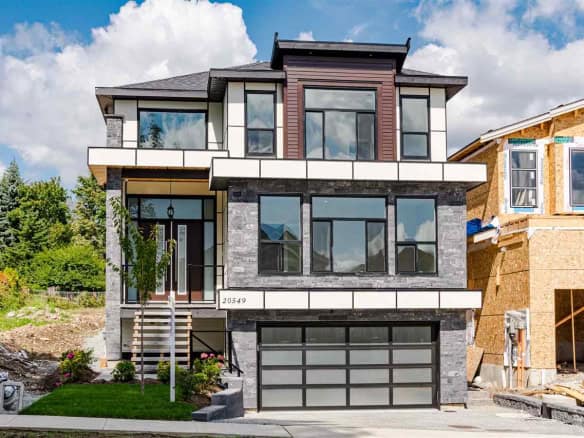 Modern luxury new construction home with contemporary design, large windows, and sleek exterior in a sought-after neighbourhood. Built by Orca Realty Inc., perfect for upscale living.