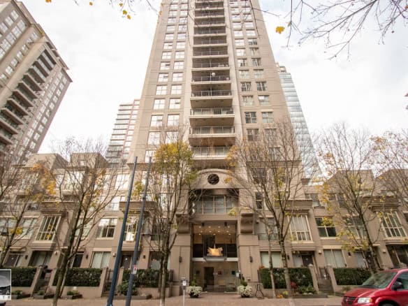 Modern high-rise apartment building in downtown, Vancouver, BC, showcasing luxury condominium homes, urban living, and cityscape views.