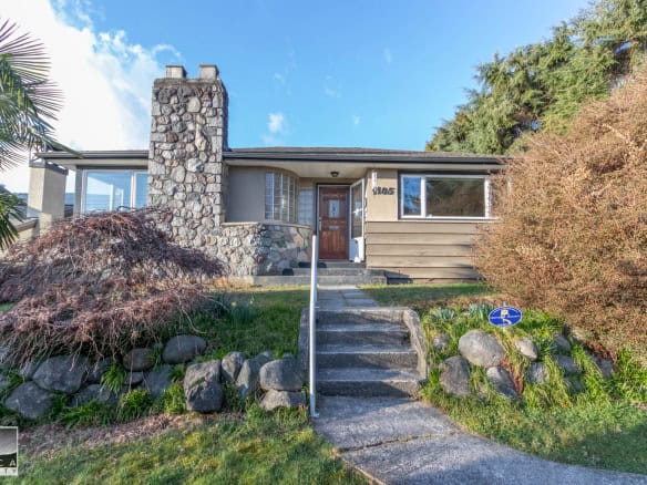 Charming single-family home with stone chimney and landscaped front yard in a desirable neighbourhood, perfect for families seeking a spacious and inviting residence.