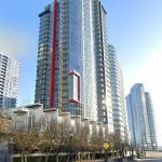 Contemporary high-rise residential building in downtown Vancouver with glass facades and modern architecture. Perfect for real estate investments or finding a luxury apartment in the city centre.