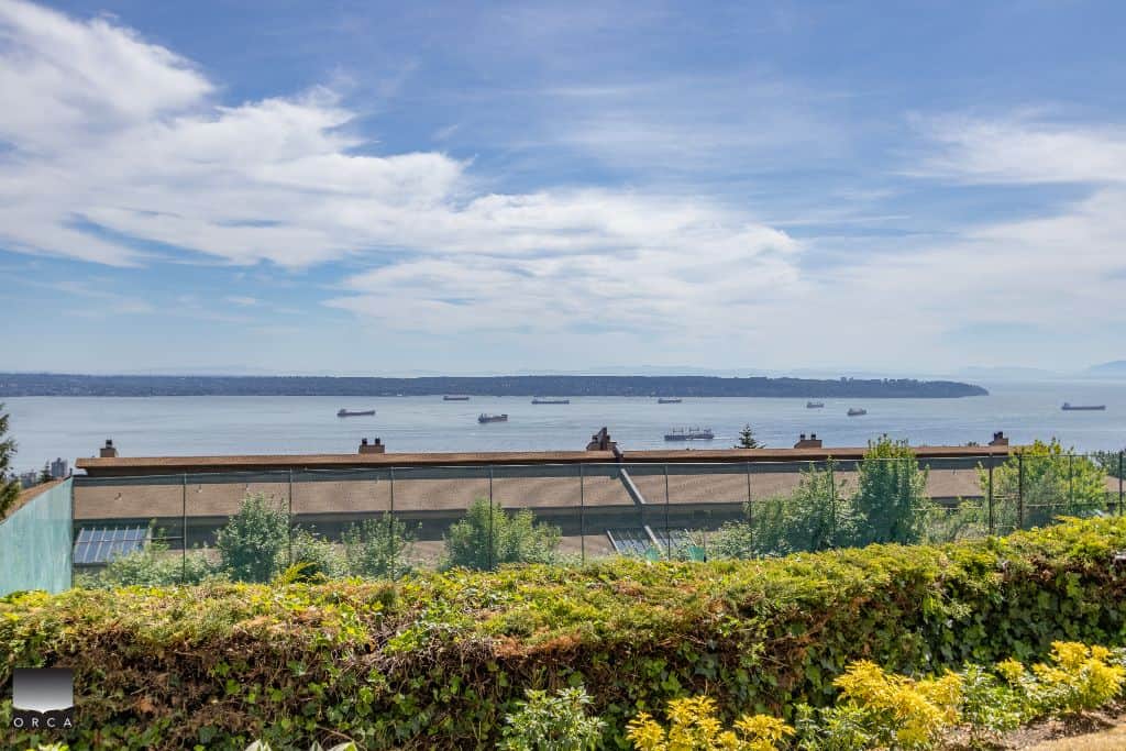 Stunning view of ocean and ships from a property listed by Orca Realty Inc., showcasing prime real estate opportunities in BC.