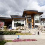 Modern contemporary home with large windows, landscaped front yard, and stylish exterior design in a suburban neighbourhood.