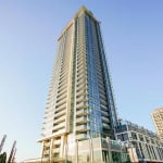 Luxurious high-rise condominium building in downtown Vancouver with modern architecture and stunning city views.