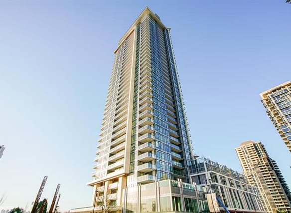 Luxurious high-rise condominium building in downtown Vancouver with modern architecture and stunning city views.