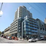 Modern multi-storey residential building in Vancouver showcasing luxury condos and urban living.