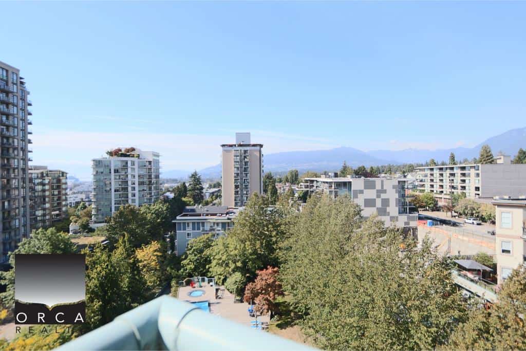 Bright Vancouver cityscape with modern residential buildings and lush greenery, showcasing Orca Realty Inc.'s prime real estate services in British Columbia.