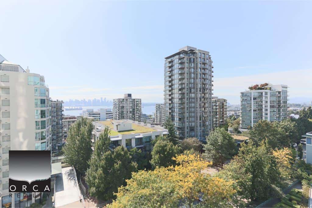 Modern high-rise residential buildings in downtown Vancouver with lush greenery and city skyline views, perfect for real estate investment and urban living.