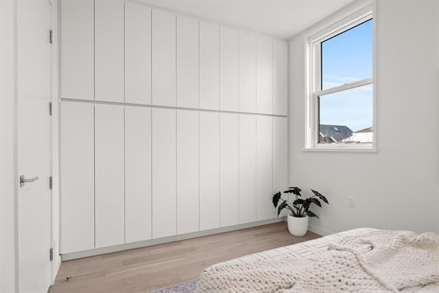 Modern white bedroom closet with minimalist design and natural light, ideal for Vancouver property listings.