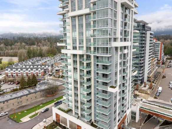 Contemporary high-rise condominium building with modern design, glass balconies, and scenic surroundings in Vancouver, BC. Features luxury urban living with amenities and panoramic views.