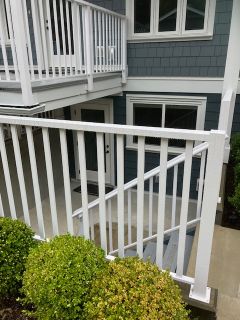 White wooden balcony railing for residential home in North Vancouver, BC, Canada.