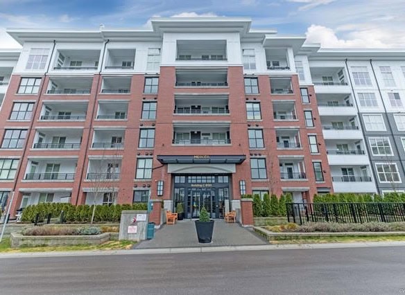 Modern multi-family residential building in Vancouver, BC, featuring contemporary architecture, spacious balconies, and well-maintained landscaping, ideal for real estate investment and rental opportunities.