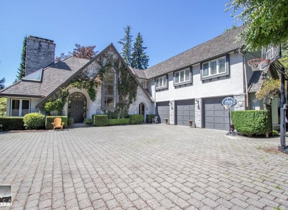 Spacious driveway and modern multi-car garage at a beautiful Vancouver-style home in West Vancouver. Perfect for families seeking luxury real estate and expert real estate services in British Columbia.