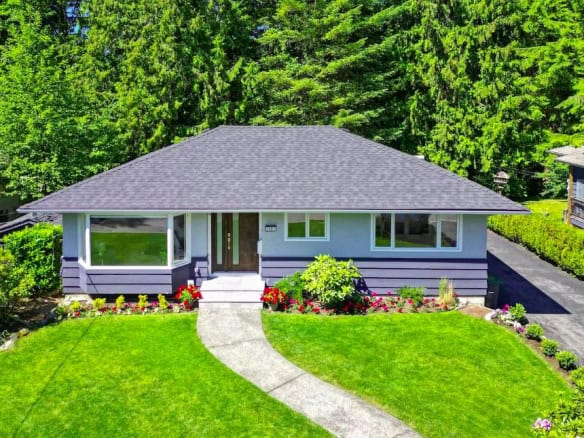Charming single-family home with lush front yard and mature trees, located in a peaceful neighbourhood, perfect for families and outdoor enthusiasts, listed by Orca Realty Inc.
