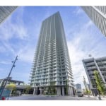 Luxurious modern high-rise condo building in downtown Vancouver, offering premier real estate opportunities and top-notch amenities.