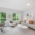 Modern living room with large windows, stylish furniture, and contemporary decor, perfect for Vancouver real estate listings.