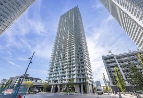 Luxury high-rise condominium building in downtown toronto showcasing modern architecture and urban living amenities.