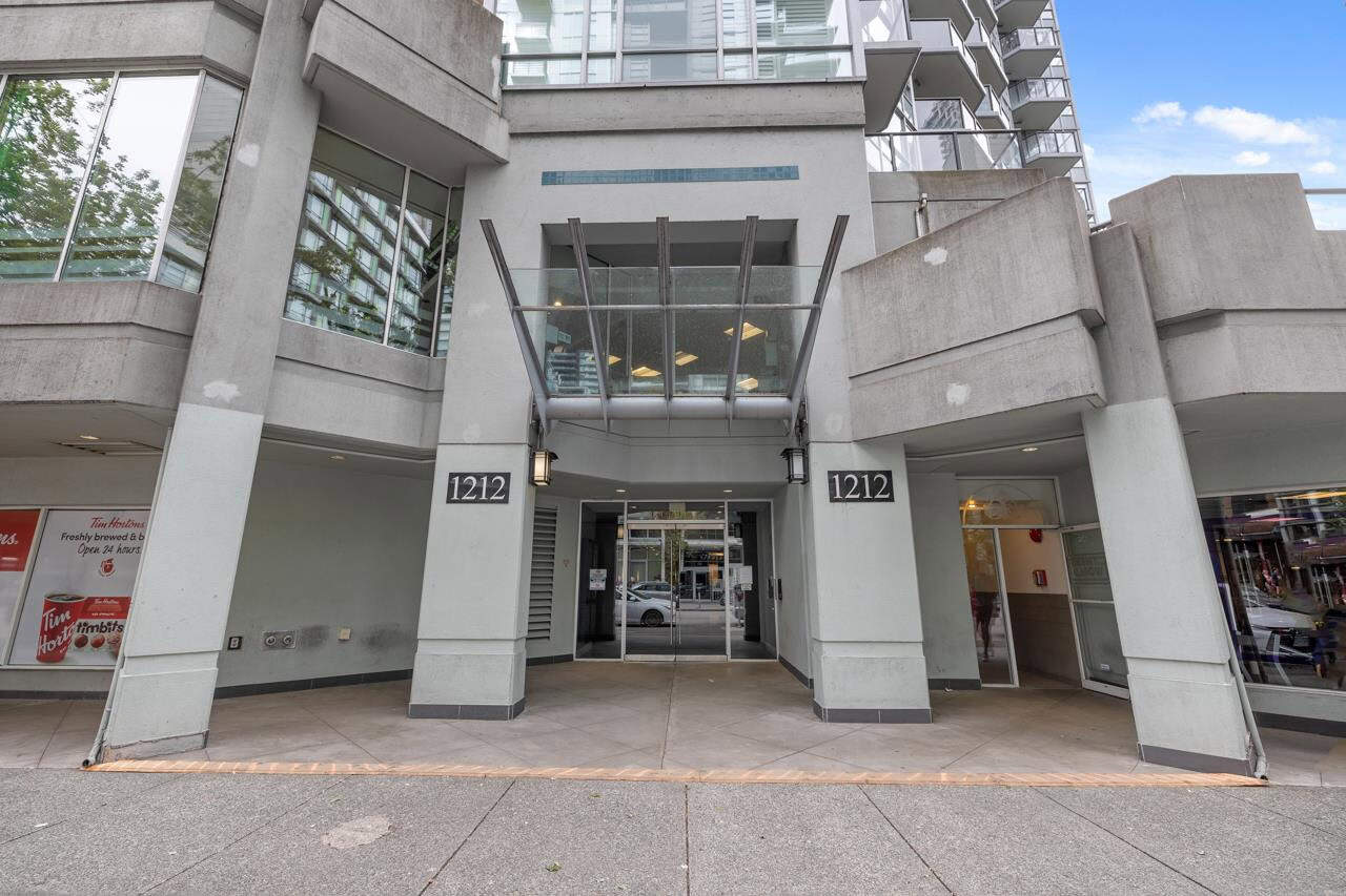 02 Modern building entrance at Orca Realty Inc. with glass doors, contemporary architecture, and street view, showcasing prime commercial real estate and property management services in Vancouver.