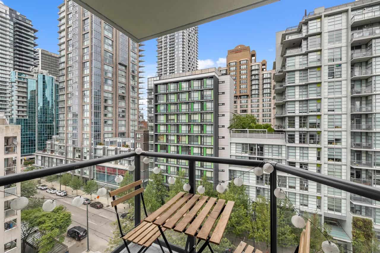 07 Modern city skyline view from a high-rise balcony in Vancouver, BC, showcasing contemporary condos, urban living, and vibrant neighbourhoods ideal for real estate investment and condo buyers in Canada.