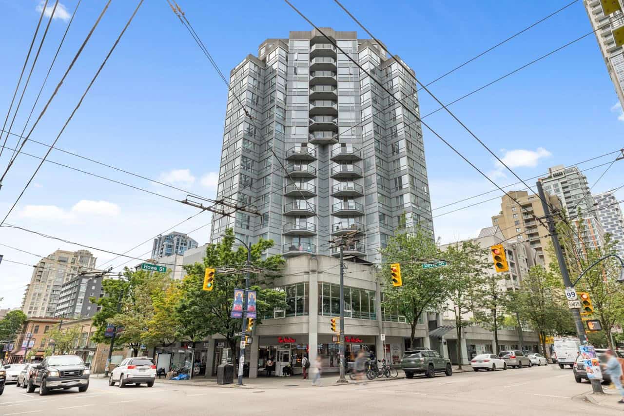 10 Modern high-rise condominium building in downtown Vancouver, BC, offering upscale residential living with retail spaces at street level. Prime urban location with extensive amenities and scenic city views.