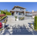 Luxury modern home with stunning architectural design and landscaped gardens, available through Orca Realty Inc., your trusted real estate partner in the Greater Vancouver area.