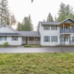 Spacious two-story family home with modern updates, situated in a serene wooded neighborhood, ideal for families seeking privacy and convenience in the Orca Realty Inc. service area.