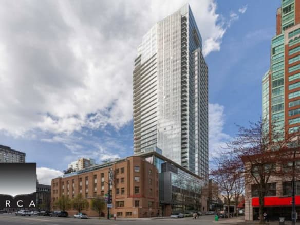 Modern high-rise downtown Vancouver condo building with glass facade and surrounding cityscape.