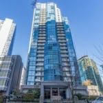 Spectacular modern high-rise condominium building in downtown Vancouver with glass facade, prime real estate location, and amenities, offered by Orca Realty Inc.