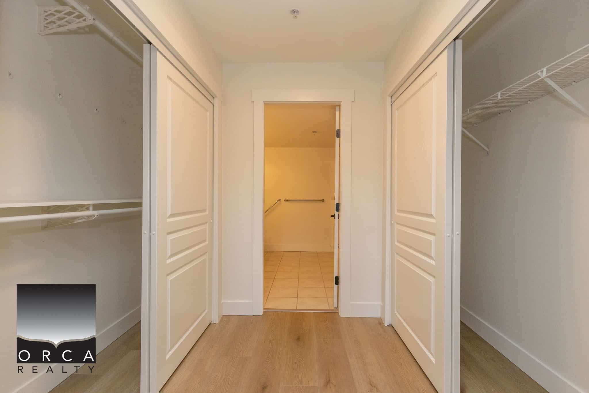 Spacious walk-in closet with built-in shelving and organization options, ideal for homebuyers looking for storage solutions in a Vancouver area property.