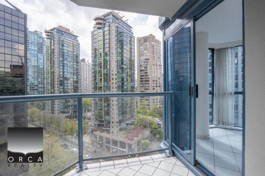 Balcony view of downtown high-rise buildings in Vancouver, modern condo rental at Orca Realty Inc.