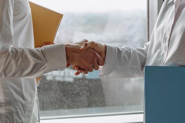 property manager and landlord shaking hands
